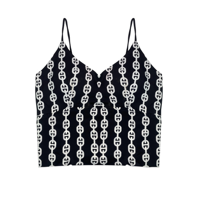 Black crop top with white chain pattern on a white background