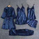 A blue silk 5-piece nightgown set including a nightgown, robe, thong, garter belt, and sleep mask, all laid out on a white background.