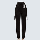 A pair of brown Sajiero trousers made of polyester and spandex, displayed flat on a surface.