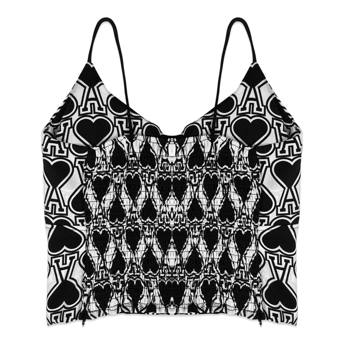 Black and white patterned top with heart and peace symbol design on a white background