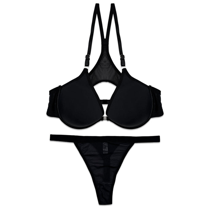 Black bra and garter belt set on a white background